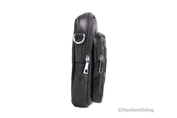 Black leather crossbody bag with multiple zippers on a white background