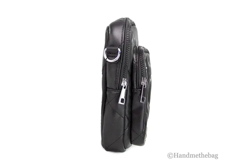 Black leather crossbody bag with multiple zippers on a white background